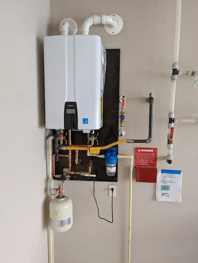 Professional plumber installing copper piping in a South Pasadena home